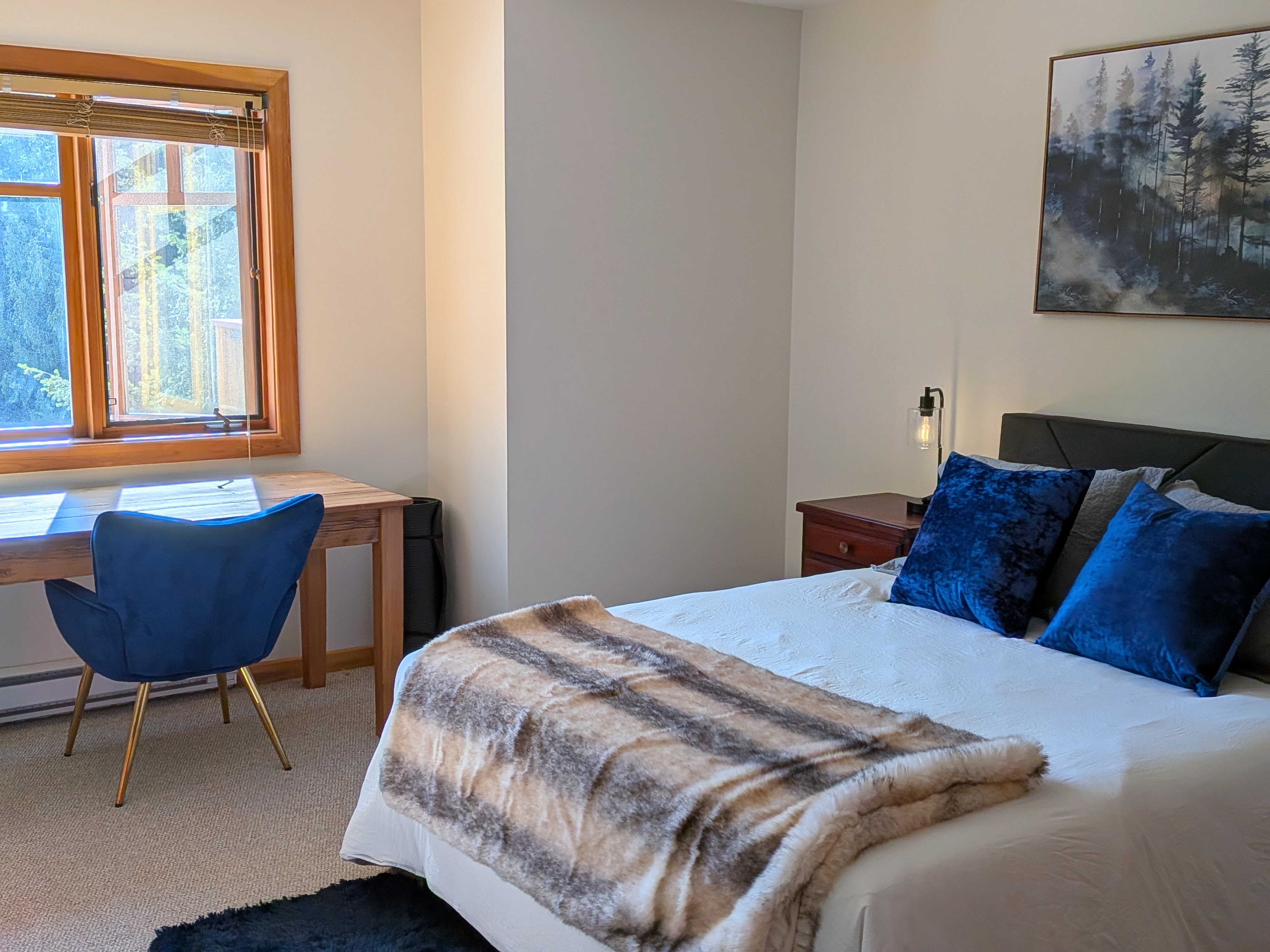 Bedroom 1 with queen bed and desk
